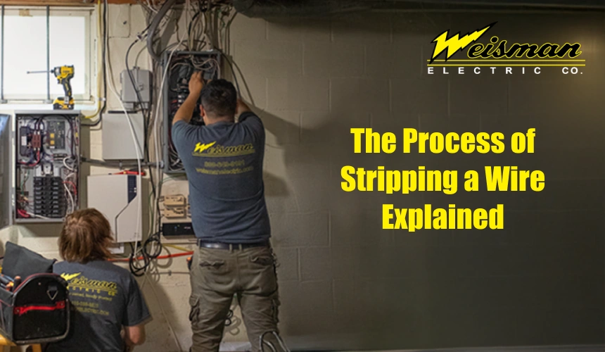 Electrician carefully stripping an electrical wire for a safe connection