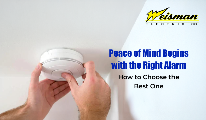 Home fire alarm system being installed in a modern living room.