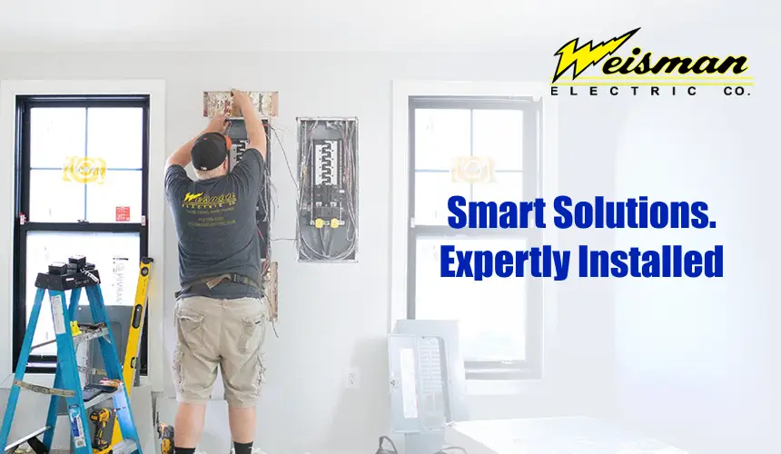 Weisman Electric Co. electrician installing smart thermostat