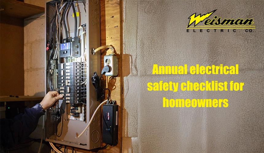 Electrician inspecting home wiring and electrical panel